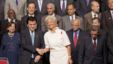 International Monetary Fund (IMF) Managing Director Christine Lagarde shakes hands with Japanese Finance Minister Koriki Jojima before posing for a group photograph in Tokyo, October 12, 2012 .