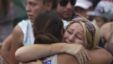 Relatives of victims of the 2002 Bali bomb attack comfort each other during a commemoration service for the 10th anniversary of the Bali bombing in Garuda Wisnu Kencana (GWK) cultural park in Jimbaran, Bali October 12, 2012. 