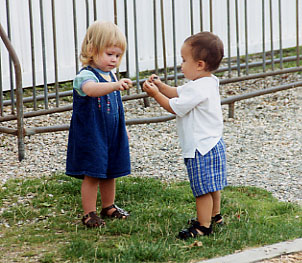 Teagan and Erik exchanging rocks