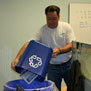 John Debisz collects recycling from desk-side bin