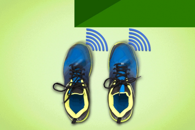 Overhead view of two blue and yellow shoes placed next to a blue icon that signifies vibration.