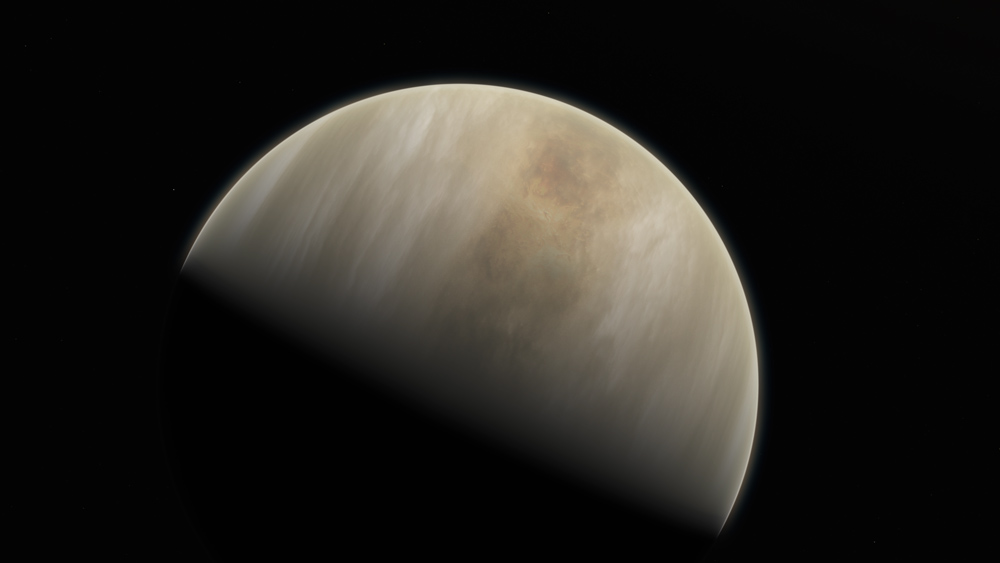 The planet Venus in space and half in darkness