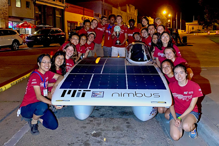 MIT solor team surround their unique vehicle