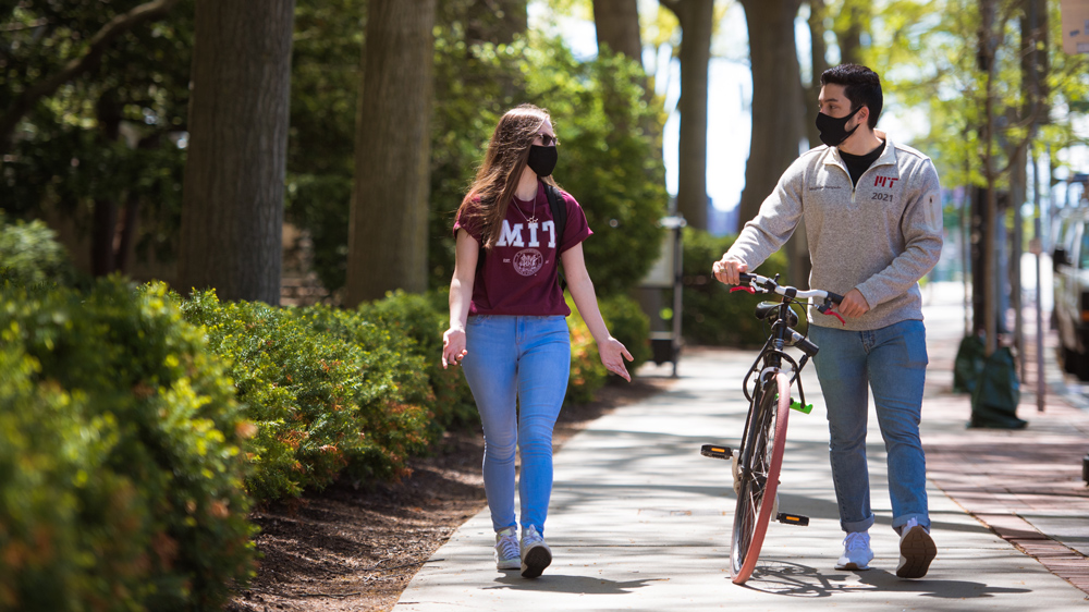 two MIT students walking down a sidewalk