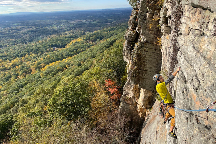 Photo of rock climber in a beautiful landscape