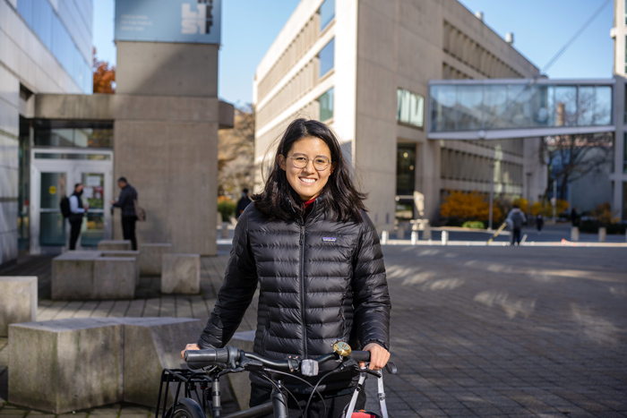 Photo of Laura Rosado with bike near List Visual Arts Center