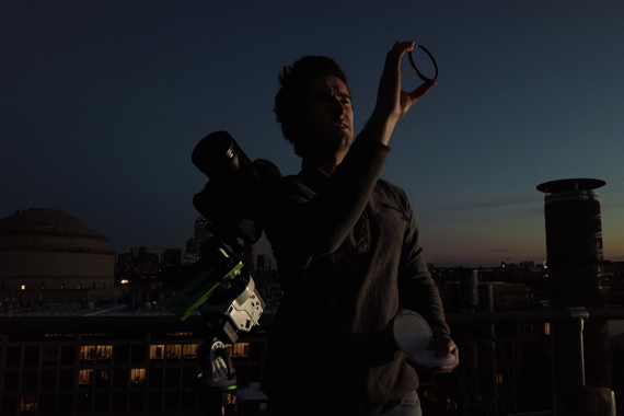 Evan Kramer on a rooftop near Boston at night