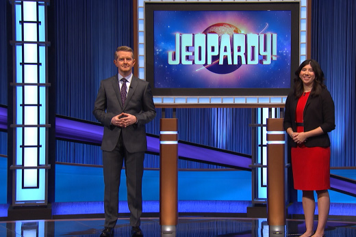 Nadège Aoki on the set of Jeopardy standing next to host Ken Jennings