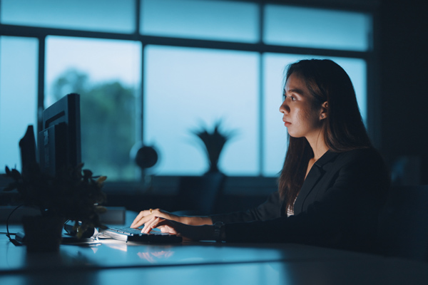 A woman working at a computer