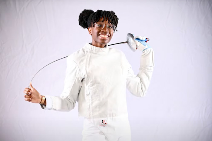 Kristen Palmer in fencing uniform poses for a portait