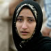 An Iraqi woman is lost in tears as she waits with others outside the prison in Abu Ghraib, in the outskirts of Baghdad, Iraq, Tuesday May 11, 2004. Iraqis gathered another day outside the prison of Abu Ghraib demanding to see their relatives after the release of shocking pictures showing prisoners being humiliated by their U.S. captors. (AP Photo/Anja Niedringhaus)