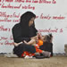 An Iraqi mother attends her baby outside the prison of Abu Ghraib in Baghdad, Iraq, as she waits for the release of hundreds of detainess, Friday, May 28, 2004.  (AP Photo/Anja Niedringhaus)
