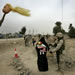 A head of a childs doll is mounted on a stick next to a checkpoint leading into the heavily guarded town of Fallujah, Iraq, Sunday, Feb. 06, 2005. (AP Photo/Anja Niedringhaus)