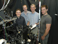 MIT Professor Wolfgang Ketterle, second from right, poses with three fellow researchers involved in the creation of a new form of matter, a superfluid gas of fermions.