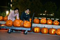 students carving pumpkins