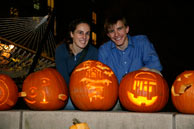 students carving pumpkins