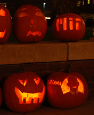 students carving pumpkins