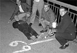 Ollie Smoot '62, measuring out the length of the Harvard Bridge.