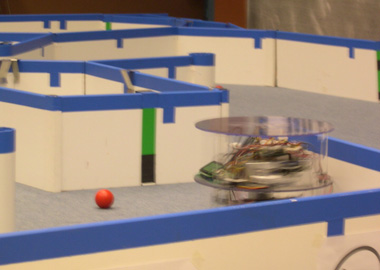 The robot chases a ball during the competition.