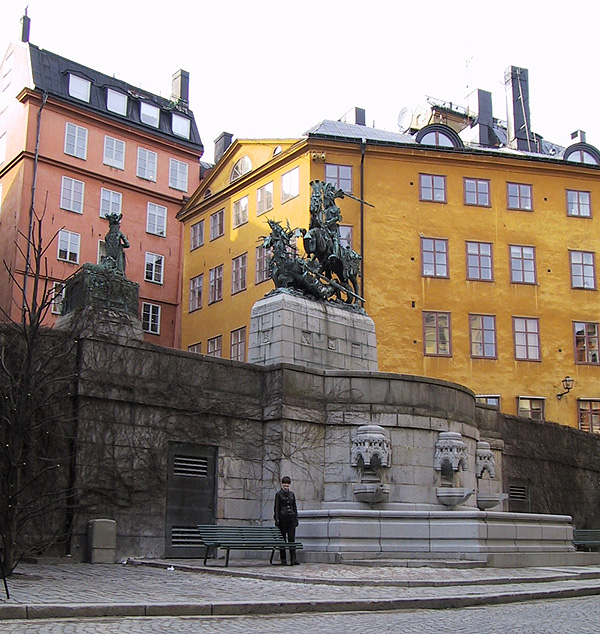 Alexis in front of a statue of St. George and the dragon.