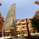 Wind tower in courtyard near student housing