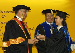 Malaysia University of Science and Technology? first graduation, December, 2004. Datuk Seri Najib, Deputy Prime Minister, Malaysia (on left) and Tajul Arus, Provost, MUST, greet a graduate.