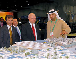 Khaled Awad, Director of Property Development, Masdar Initiative, Samuel W. Bodman, U.S. Secretary of Energy, and Sultan Al Jaber, CEO ADFEC, viewing the Masdar City model.