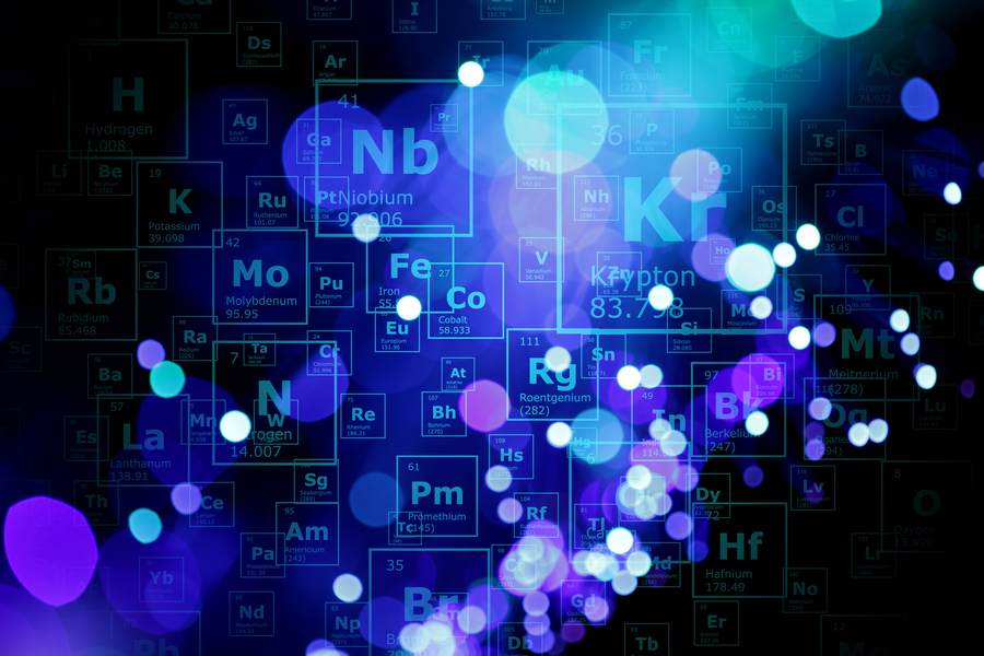 illustration with elements from the periodic table shown as a cloud of tiles, blue background, MIT