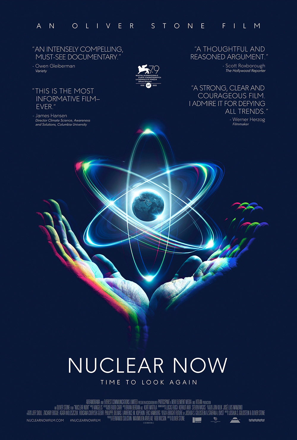 blue movie poster with image graphic of two hands below an atom