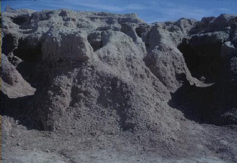 Badlands. Small-scale erosion features. Pebbles in lower left corner are 2-5 cm in diameter.