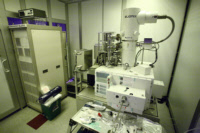 Elionix Main System. Control rack on the right, stage and electron gun on left.