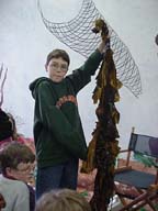 Student holding up kelp