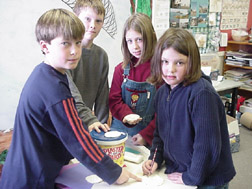 Students making sand dollars