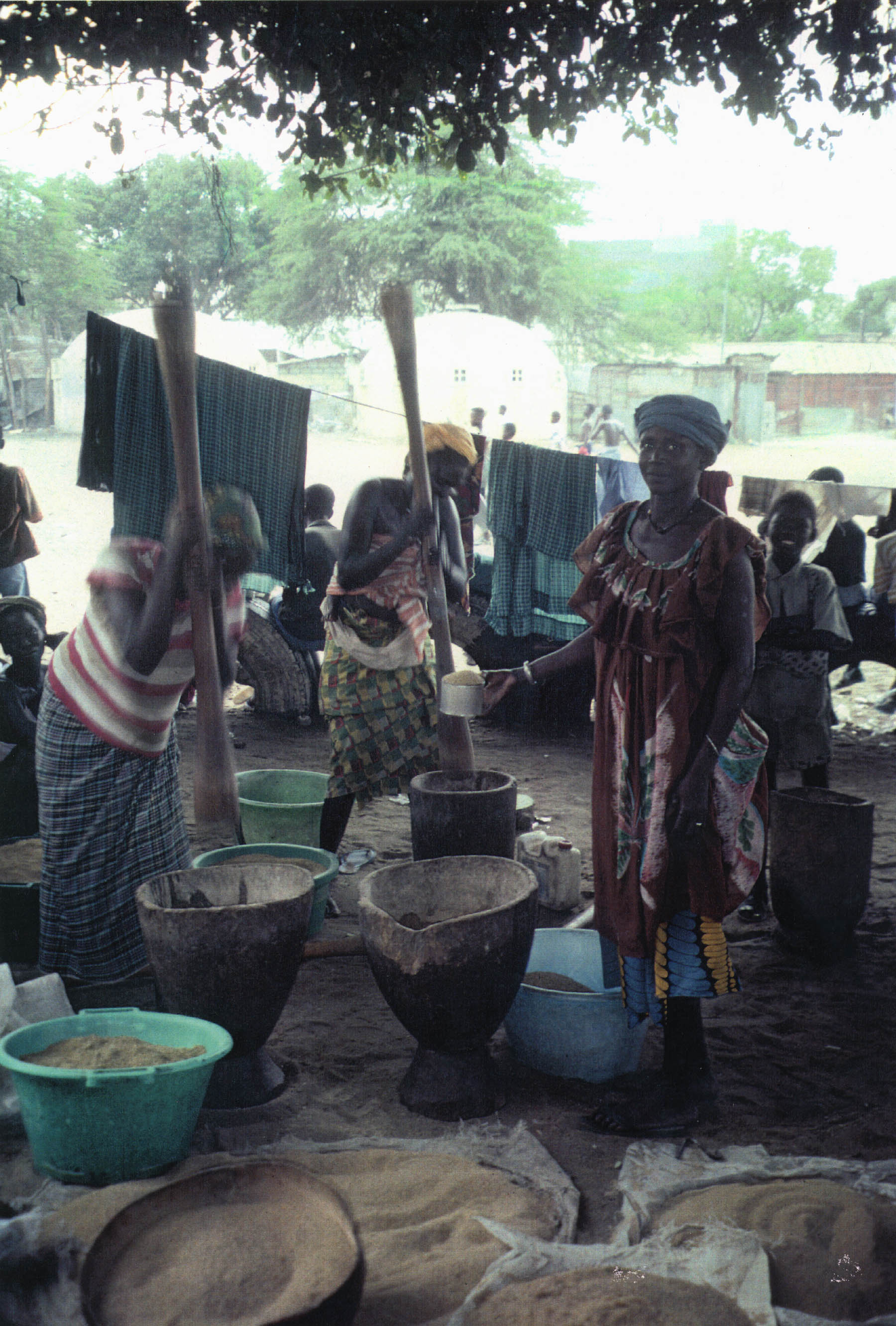 Woman Grinding Grain