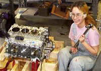 student_with_engine_and_torque_wrench.jpg (11662 bytes)