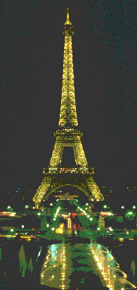 eiffel tower illuminated at night so that one clearly sees the shape of the tower