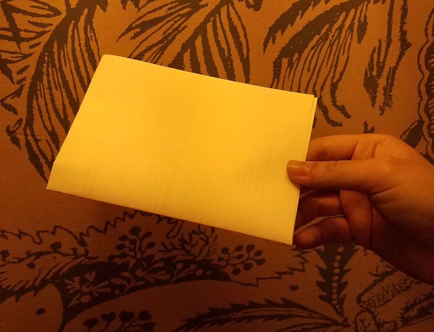 a sheet of white paper under tungsten light, auto white balance disabled