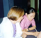 Gordana works with Jang to prepare for the session on women's activism.