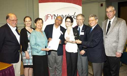 Chuck Shubert at far left with seven other people at the 2012 JFYNet Innovation Award ceremony