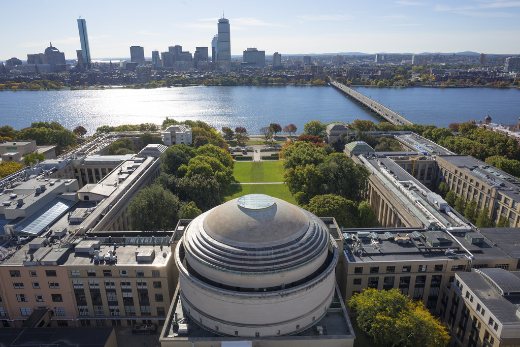 Aerial view of the campus, with a glimpse of the Boston skyline