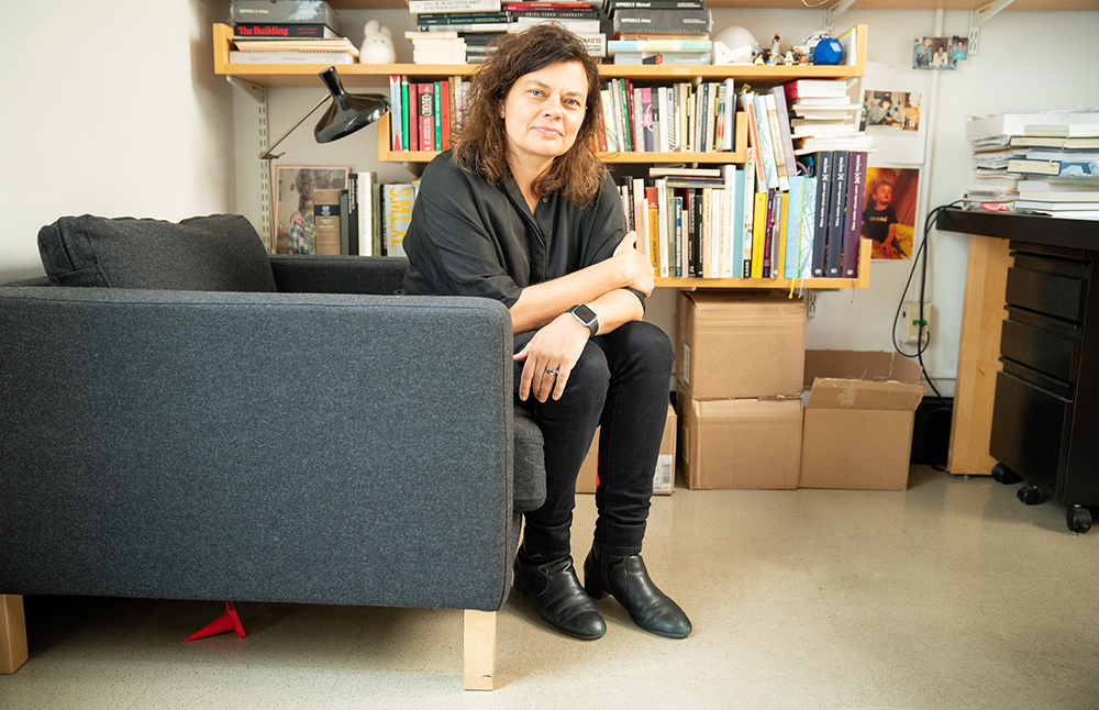 a photograph of Ana Miljacki sitting in her office