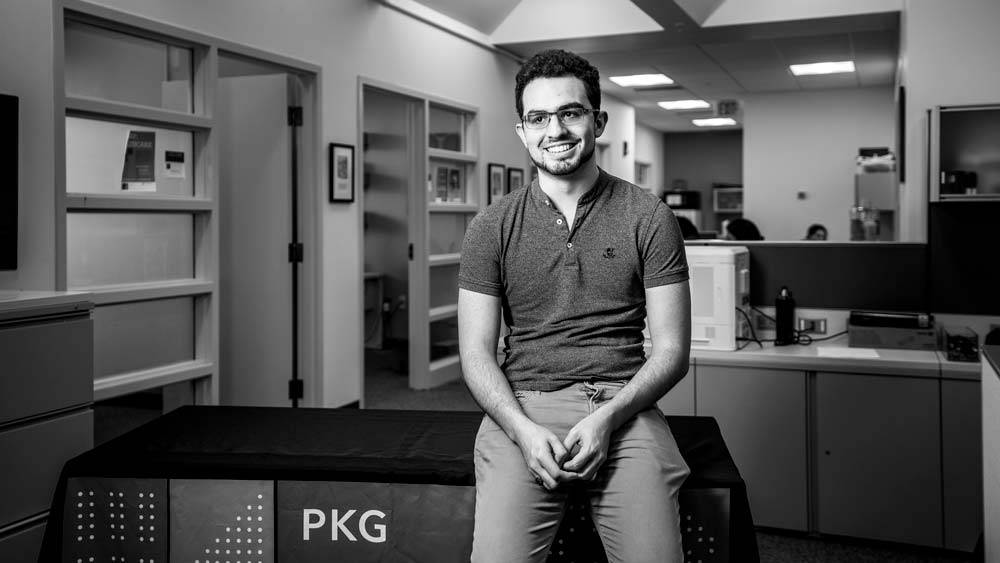 Rene Garcia Franceschini sitting in an MIT office looking off to the side