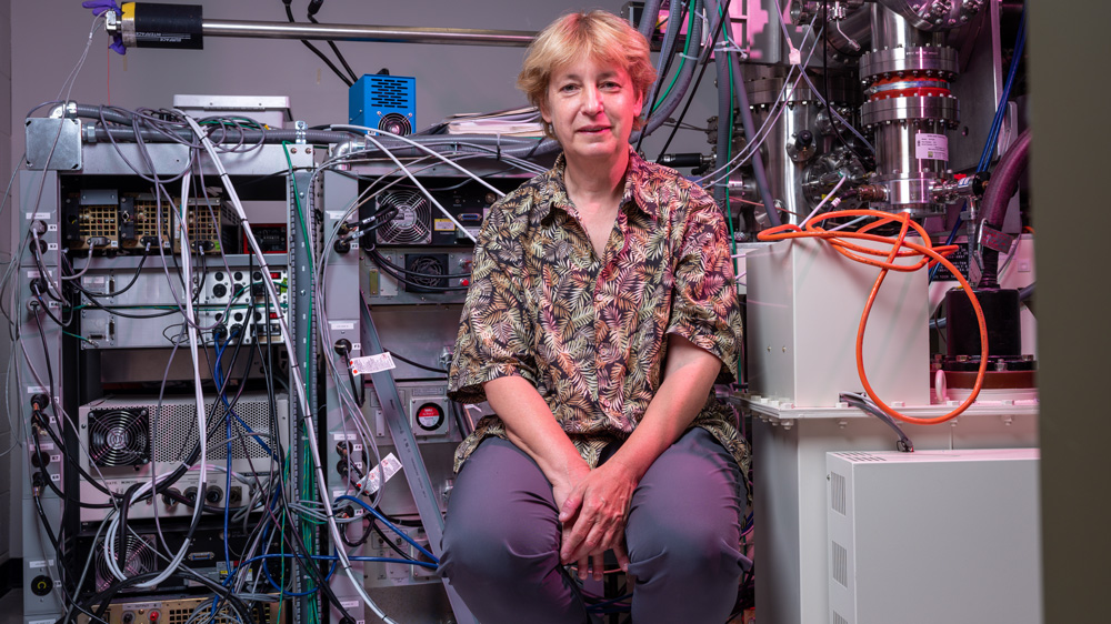 Frances Ross with microscope lab, photo by Jared Charney