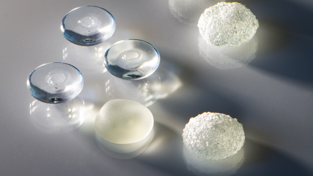 different textured silicon implants on a gray surface