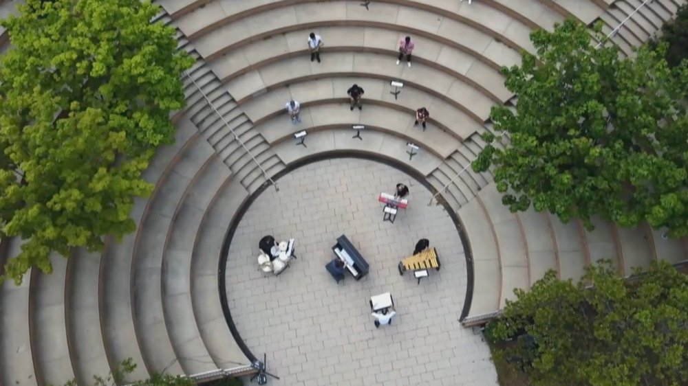 aerial shot of musicians playing outside at MIT's Stata Center