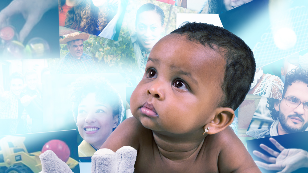 Photo-collage showing infant contemplating various photographs