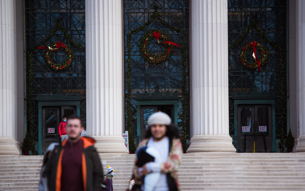 MIT's entrance at 77 Massachusetts Avenue decorated with giant holiday wreaths