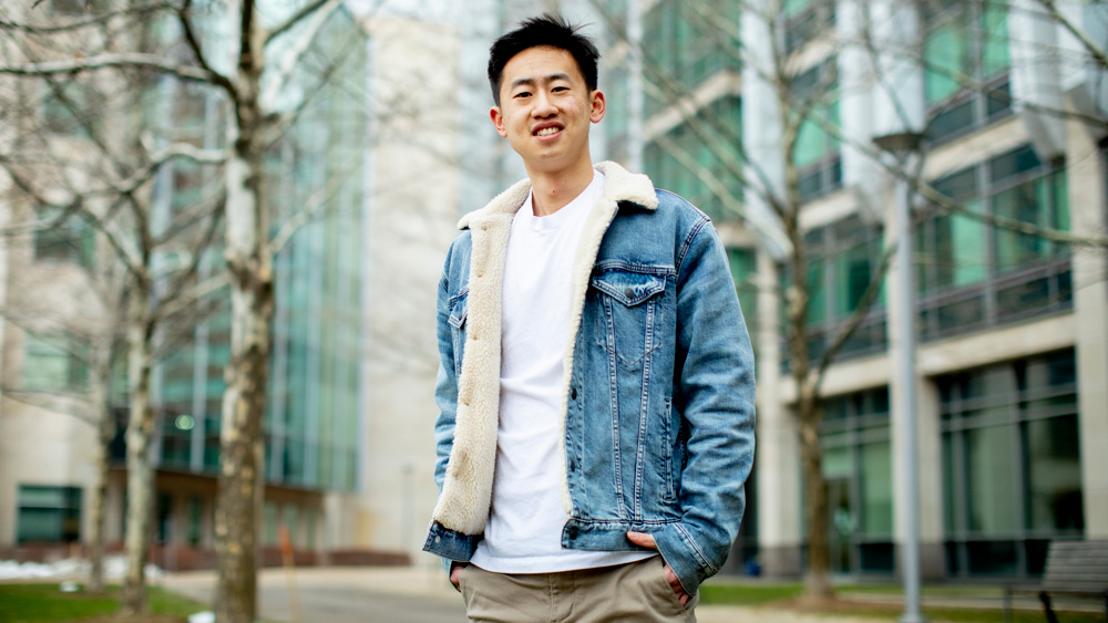 Daniel Zhang standing outside at MIT