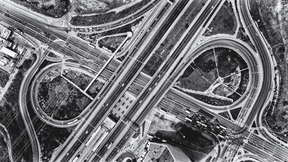Aerial photo showing overlapping highways with traffic