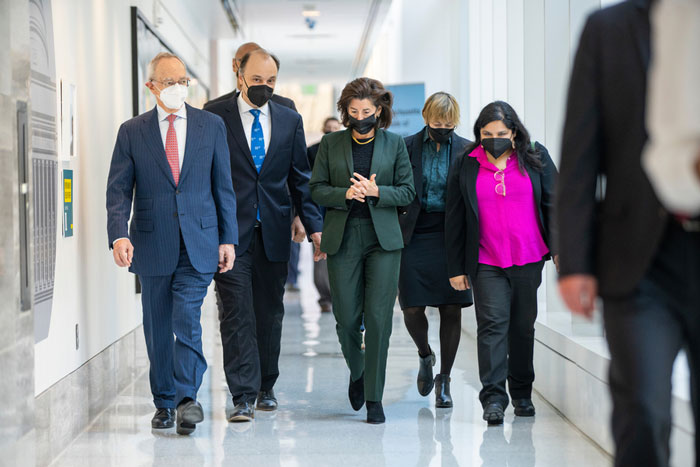 MIT President L. Rafael Reif, MIT.nano Director Vladimir Bulovic, U.S. Secretary of Commerce Gina Raimondo, MIT Vice President for Research Maria Zuber, and City of Cambridge Mayor Sumbul Siddiqui, walking through a hallway during a tour of MIT.nano 